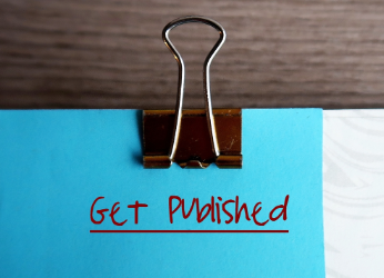 Sticky note on a folder that says 'get published'